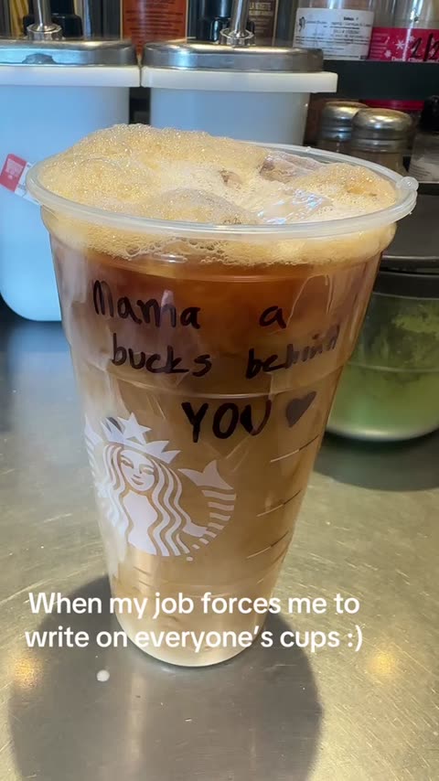 Barista POV: iced coffee cup with Sharpie message ("Maria a bucks babe ... YOU") at hand-off plane; overlay "When my job forces me to write on everyone's cups".